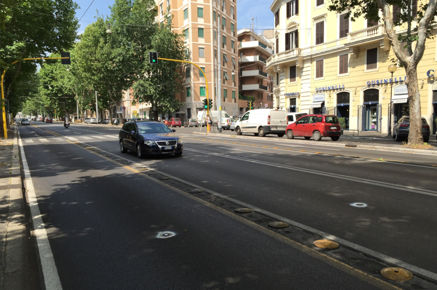 smart traffic sensor for wireless vehicle detection installed in the middle of the lane in a street in Rome